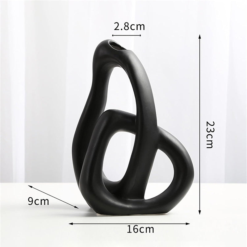 Vase noir design entrelacé